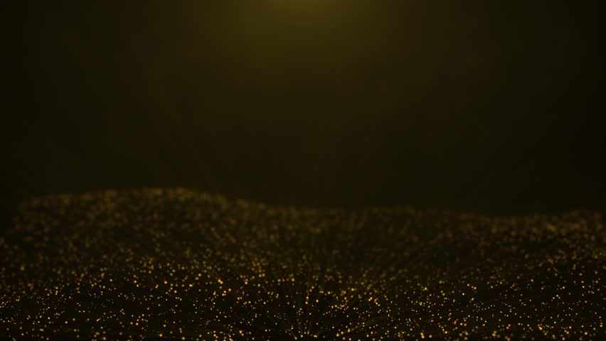 glittering glowing golden particles on dark bakcground