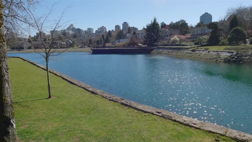 Scenic View in a Moden City Park, sunny day. Granville Island in False Creek, Vancouver, British Columbia, Canada. Slow Motion Cinematic