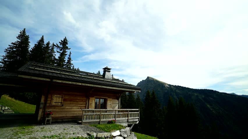 Alps wood chalet during summer timelapse