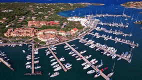 Italy. Sardegna island. Luxury resort Porto Cervo. Marina with sailing boats, aerial drone video