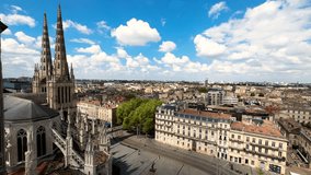 Aerial cityscape view on the old town of Bordeaux city with st Andrew cathedral during a sunny day in France. High quality 4k footage