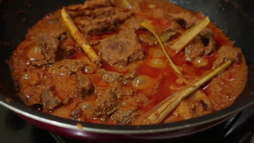 cooking beef rendang with spices, typical Indonesian food Royalty-Free Stock Footage #1103014655