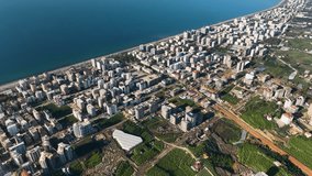 City panorama on the seashore 4K aerial view Panorama Of The Buildings On The Coastline City Alanya Turkey Aerial view