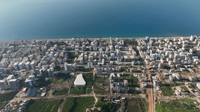 City panorama on the seashore 4K aerial view Panorama Of The Buildings On The Coastline City Alanya Turkey Aerial view