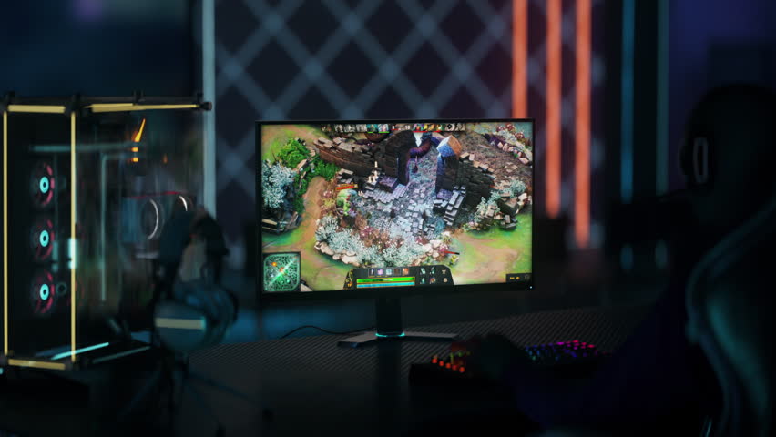 Gaming in the multiplayer online battle arena action simulator on a PC screen. Using a gaming PC screen in the competitive tournament. Gaming PC screen displaying the fight in the digital simulator. Royalty-Free Stock Footage #1103024463