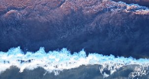 Nature video Cinematic scene footage Top-view beach sea Drone flying over the beach Top-view wave beach sand Wave sea water on sandy beach at sunset Aerial view drone camera high quality Tropical sea 