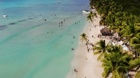 Aerial view of Saona Island, Dominican Republic, showcasing pristine beaches, turquoise waters, lush palm trees, and Caribbean charm. Ideal for travel and tourism projects.