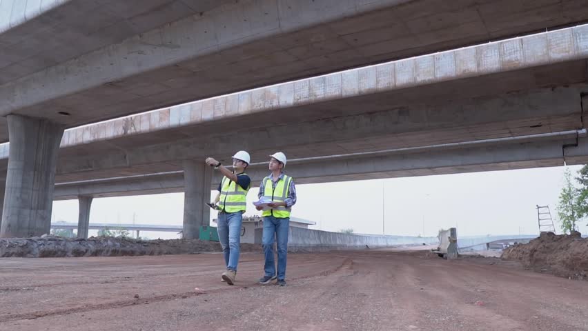  Civil engineers team work at road construction sites to supervise new road construction and inspect road construction sites. Road construction supervision. Royalty-Free Stock Footage #1103039861