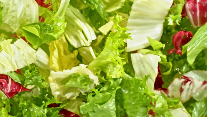 Super slow motion of rotating fresh lettuce flying up in the air. Filmed on high speed cinema camera, 1000 fps, placed on high speed cine bot, following the target. Royalty-Free Stock Footage #1103041979