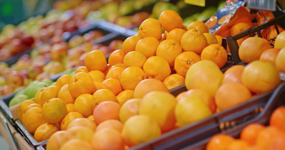shelf with tangerines in food market, closeup, useful citrus fruits full of vitamin C, 4K, Prores