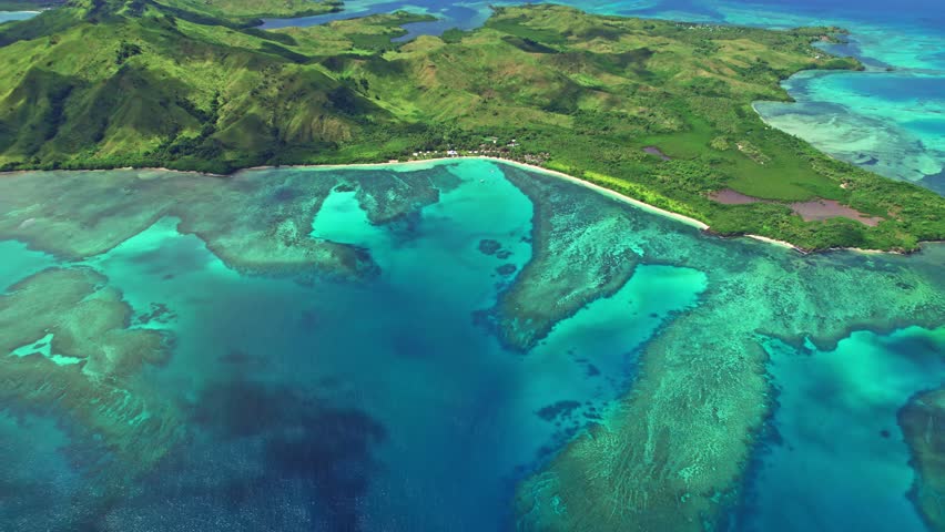 Epic reveal shot of tropical Nacula island and coral reef, Yasawa, Fiji. Royalty-Free Stock Footage #1103051523