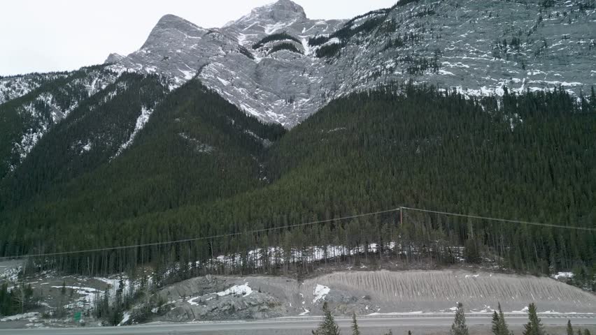 Aerial view pan up to mountains - Alberta, Canada - 4k