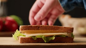 Delicious Ham, Salami, Cheese and Vegetables Sandwiches on Toasted Whole Grain Bread, chef cooking morning sandwich. - Powered by Shutterstock - Get 15% off with code: PIKWIZARD15