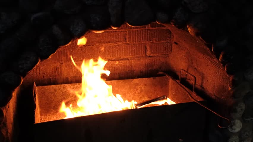 Burning fire in the fireplace. Wood logs. Cozy warm fireside. Brick oven - Powered by Shutterstock - Get 15% off with code: PIKWIZARD15