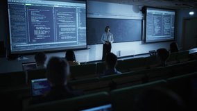 Young Female Lecturer Giving a Web Development Masterclass to Diverse Multiethnic Group of Students in Dark College Room. Projecting Slideshow with Professional Programming Code Language - Powered by Shutterstock - Get 15% off with code: PIKWIZARD15