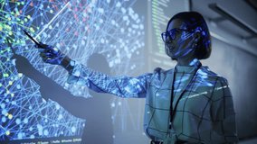 Young Female Teacher Giving a Data Science Presentation in a Dark Auditorium with Projecting Slideshow with Artificial Intelligence Neural Network Architecture. Business Startup and Education Concept - Powered by Shutterstock - Get 15% off with code: PIKWIZARD15