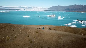 Aerial drone footage of icebergs floating in Jokulsarlon glacier lagoon in Iceland. Scenic view of Ice bergs. Artic nature ice landscape. Melting glacier in Iceland. Global warming, climate change.