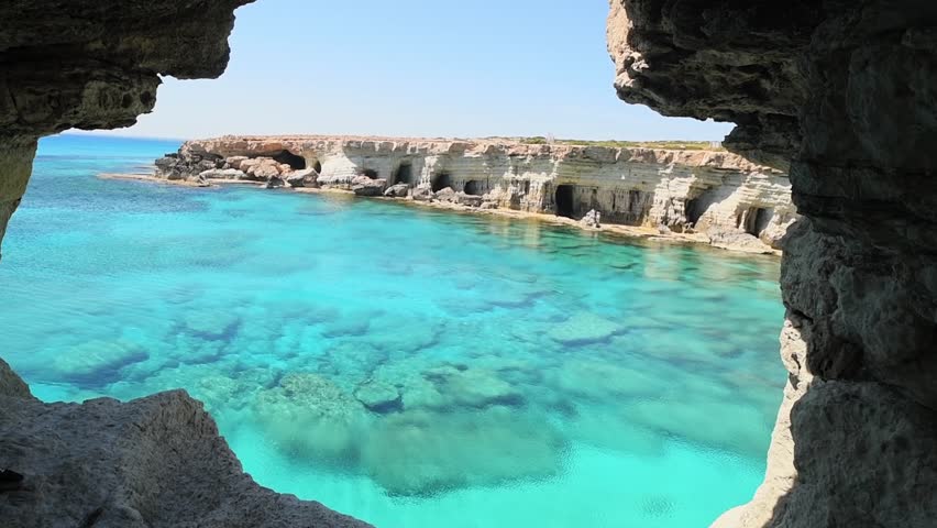 Sea cave arch viewpoint near Cape Greko, Capo Greco, Ayia Napa and Protaras on Cyprus island, Mediterranean Sea. Breathtaking seascape. Turquoise crystal clear waters in sunny day