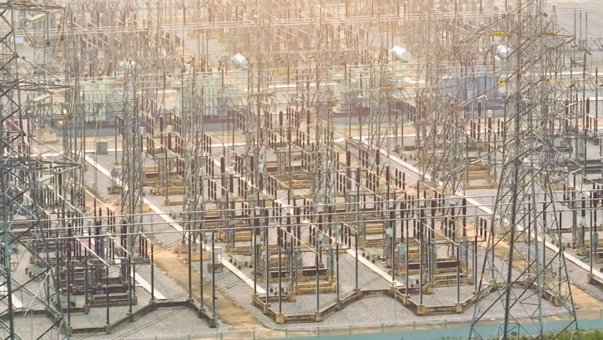A high voltage power station is a complex used for generating, transmitting, and distributing electrical power at high voltages. It is usually located in a remote area, away from residential areas
 Royalty-Free Stock Footage #1103087397