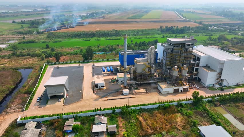 A landfill power generation plant is a facility that extracts methane gas from landfills and converts it into electricity, reducing greenhouse gas emissions and generating renewable energy. Drone
 Royalty-Free Stock Footage #1103087425