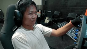 asian men playing esport car racing in Car Driving Simulator
