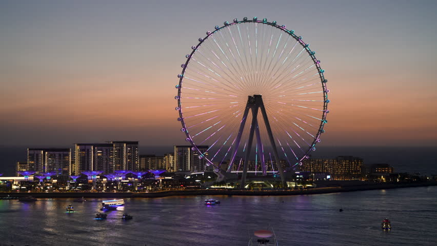 Spiral lights on structure of Ain Dubai Observation Wheel on BlueWaters Island at sunset Royalty-Free Stock Footage #1103095567