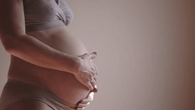 pregnant woman. health pregnancy motherhood procreation concept. close-up belly of a pregnant woman. woman waiting for a indoors newborn baby. pregnant woman holding her belly sunlight - Powered by Shutterstock - Get 15% off with code: PIKWIZARD15