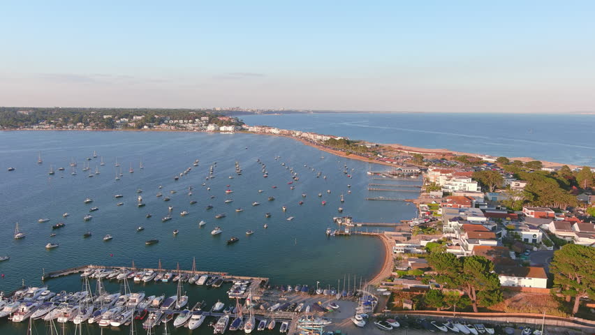 Poole, UK: Aerial view of city in England, famous seaside resort by Atlantic Ocean, Sandbanks Beach in summer at sunset - landscape panorama of United Kingdom from above