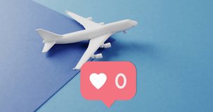 Animation of media icon with heart over plane on blue background. Social media and travel concept, digitally generated video.