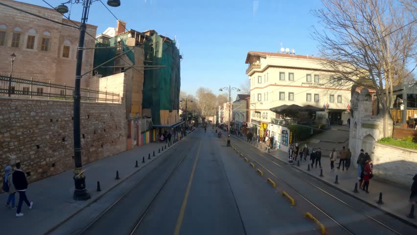 Modern tram on the street of istanbul. Road trip in istanbul. View of Istanbul from the car window. View of the streets of istanbul from a car