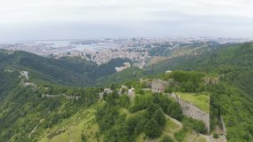 Inscription on video. Genoa, Italy. Forte Sperone is a key point of the 19th-century Genoese fortifications and is located on top of the Mura Nuove. View of Genoa. Name is burning, Aerial View, Depar
