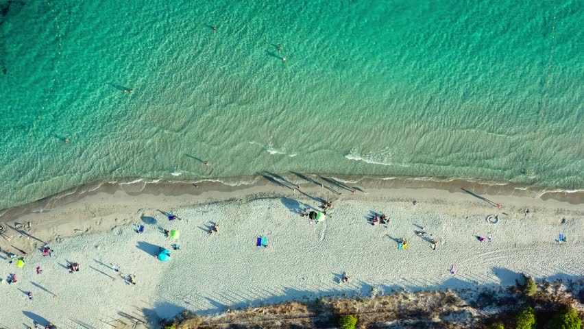 The beautiful aerial view of Corsica's beach captures the green waters and sandy beache. Corsica, France. Top view