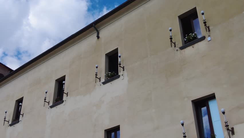 Windows With Lamps On The Building On The Side Street Of Amalfi Coast In Italy. Low Angle