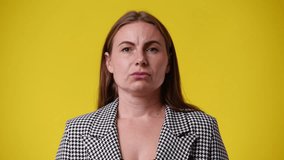 4k video of one woman feeling bad over yellow background.