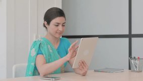 Young Indian Woman Doing Video Chat on Tablet