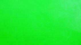 Smoke green screen concept, white smoke flowing slow motion on green screen background, fog or steam mist motion on ground and flowing up, same vapour or cloud, chroma key screen for creative design