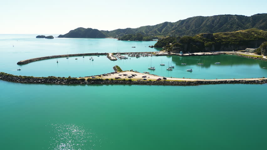 Aerial view of some boats safely docked on Port Tarakohe, New Zealand