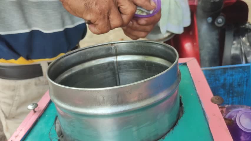 ice cream seller servicing ice cream for buyers