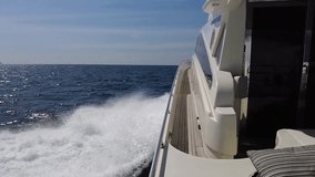Private motor yacht in motion, slow motion video, motor yacht sails on the waves