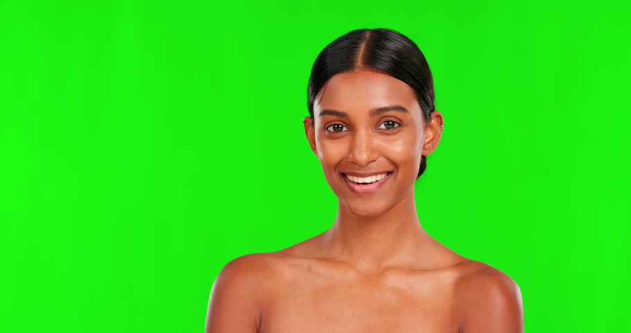 Face, beauty and a woman pointing on a green screen background in studio for antiaging skincare. Portrait, skin and natural treatment with a happy young female model advertising on chromakey mockup Royalty-Free Stock Footage #1103150879