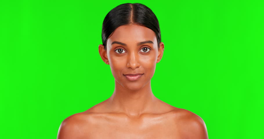 Beauty, smile and a woman on a green screen background in studio for natural skincare cosmetics. Portrait, skin and antiaging treatment with a happy young female model advertising on chromakey mockup Royalty-Free Stock Footage #1103150983