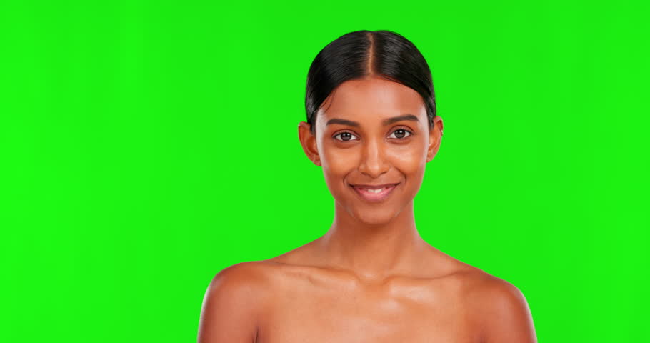 Beauty, choice and a woman pointing on a green screen background in studio for natural skincare. Portrait, select or antiaging treatment with a happy young female model marketing on chromakey mockup Royalty-Free Stock Footage #1103151039