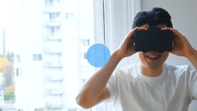 Animation of network of connections over asian boy using vr headset. Global connections, computing and data processing concept digitally generated video.