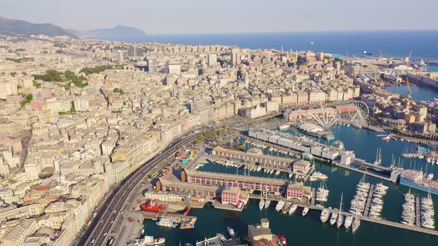 Inscription on video. Genoa, Italy. Central part of the city, aerial view. Ships in the port. Text from small balls, Aerial View
