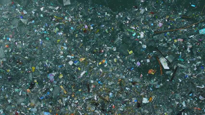 Ocean water and plastic trash island. Aerial view of pollution by plastic rubbish Royalty-Free Stock Footage #1103168567