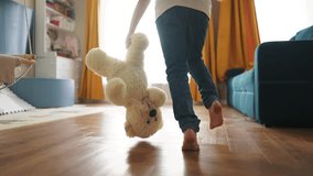 baby running indoors with bare feet. close-up of the kid leg runs with toy bear. happy family kid concept. baby running and playing dream indoors. little girl daughter runs fun around the house - Powered by Shutterstock - Get 15% off with code: PIKWIZARD15