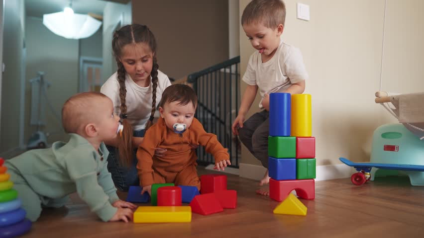 baby boy play kids girl and in kindergarten. group of children playing toys in kindergarten on the floor. friendly family preschool education indoor concept lifestyle. baby play toddler home Royalty-Free Stock Footage #1103168661