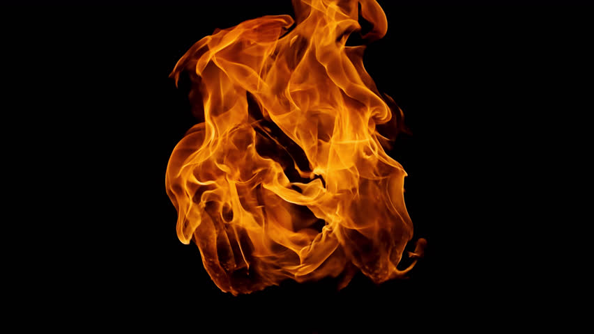 Slow motion Red flame bursting isolated on black background, Real shot of fire blast, Close up view of Fire ball burning best for logo reval. Fire and flames  in 4K. 