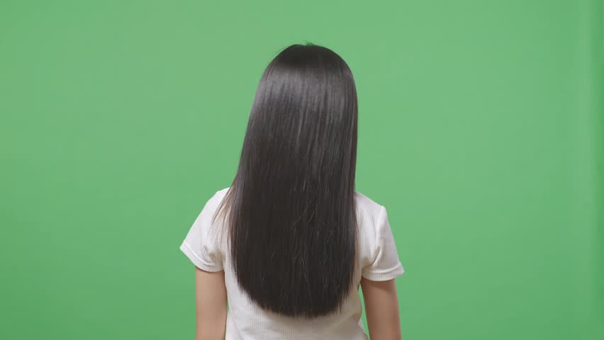 Back View Of A Woman Shaking Her Head Showing Her Long Black And Blond Straight Healthy Hair In The Green Screen Background Studio
 Royalty-Free Stock Footage #1103171815