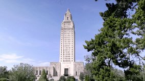 Louisiana state capitol building in Baton Rouge, Louisiana with establishing shot.
